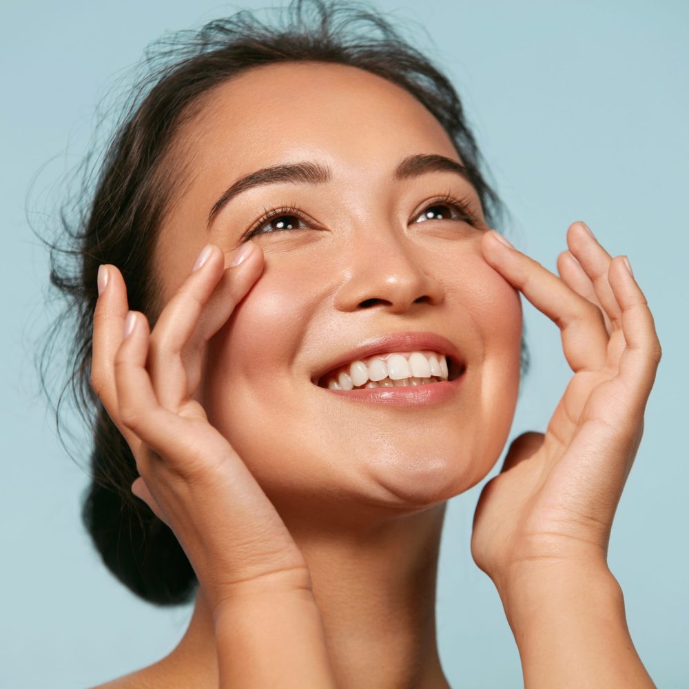 Skin care. Woman with beauty face touching healthy facial skin p