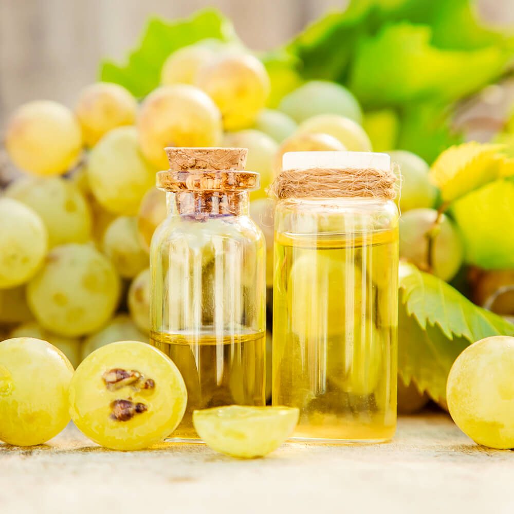 grapeseed-organic Two cork-topped bottles of organic grapeseed essential oil are an all-natural way to maintain good health and appearance.